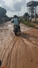 Motorcycles navigate muddy roads in Ihiagwa, Nigeria delivery scene
