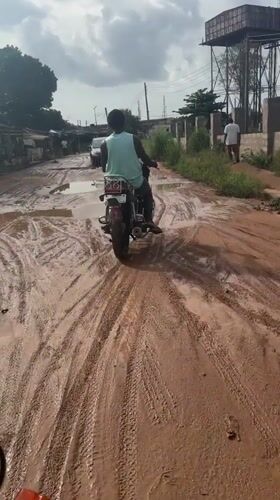 Motorcycles navigate muddy roads in Ihiagwa, Nigeria delivery scene
