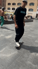 Barcelona morning: skateboarder practices amid medieval history plaques