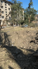 Strike damage across a Kyiv residential area, early July morning