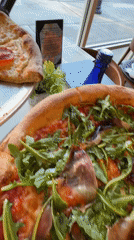 Two pizzas displayed on table in Myrtle Beach