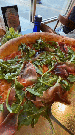 Two pizzas displayed on table in Myrtle Beach