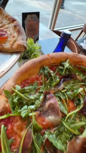 Two pizzas displayed on table in Myrtle Beach