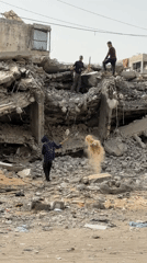 Three men observed at destruction scene in Gaza