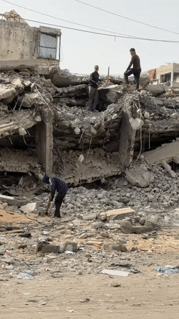Three men observed at destruction scene in Gaza