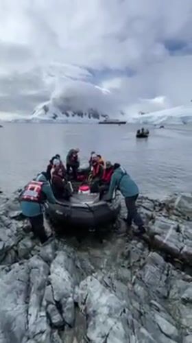 Cruise passengers make Antarctic zodiac landings from ship Hondius