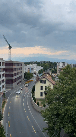 Aerial view of a curved Renens street under cloudy skies