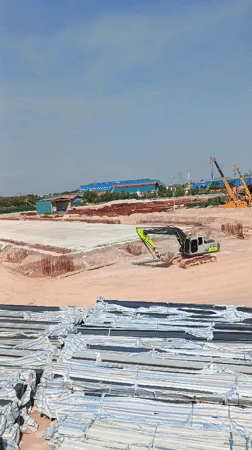 Batam's industrial waterfront: tugboats, cranes, and active construction