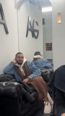 Woman receives hair treatment at Rehovot salon Monday morning