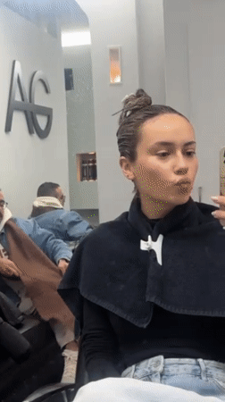 Woman receives hair treatment at Rehovot salon Monday morning