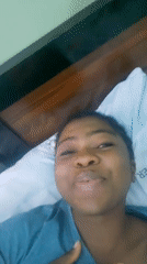 Young Woman's Playful Bedroom Moments Captured in Nigeria