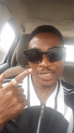 Man in striped jacket observed in car in Adankolo