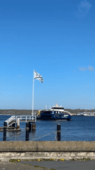 Woman documents sunny spring day touring Kiel marina and city