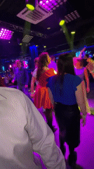 Nightclub patrons dance and socialize at Saint Petersburg venue