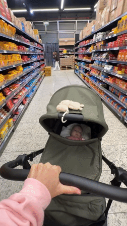 Parent shops with baby at Florianópolis supermarket