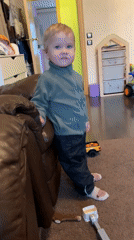 Toddler plays with toys in Saint Petersburg living room