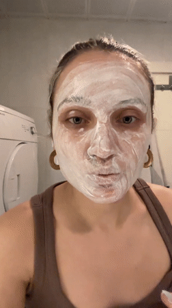 Woman documents skincare routine in Esenyurt bathroom