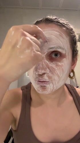 Woman documents skincare routine in Esenyurt bathroom