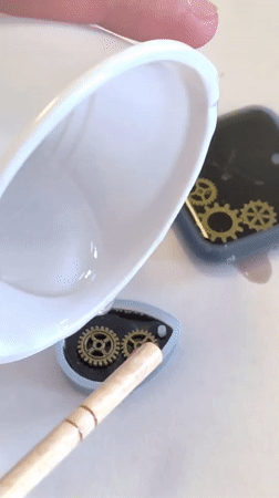 Person pours liquid into gear mold in Markovskii