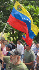 Street protest with missing persons banner held in Caracas