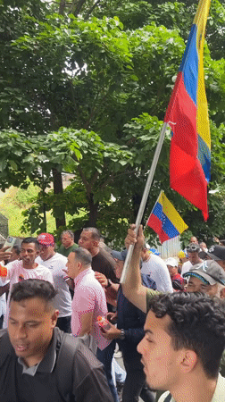 Street protest with missing persons banner held in Caracas