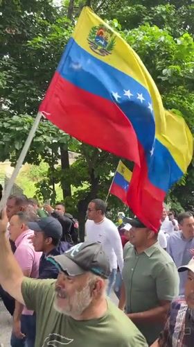 Street protest with missing persons banner held in Caracas