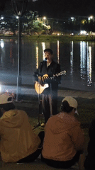 Guitarist performs evening lakeside concert in Da Lat, Vietnam