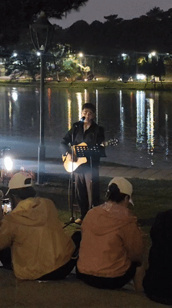Guitarist performs evening lakeside concert in Da Lat, Vietnam