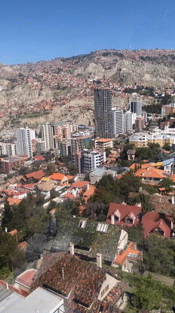 Cable car rider films panoramic view of La Paz