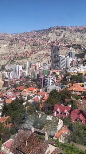 Cable car rider films panoramic view of La Paz
