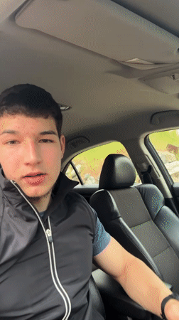 Young man poses for car selfies in Zlatograd, Bulgaria