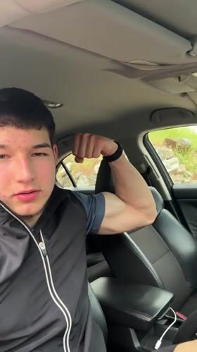 Young man poses for car selfies in Zlatograd, Bulgaria