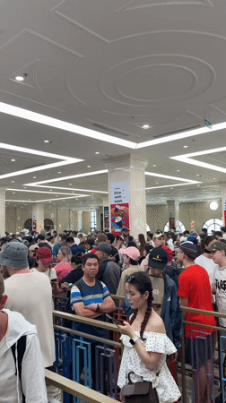 Large crowds queue in colorful barrier system in Nha Trang