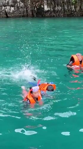Early morning swimmers spotted in turquoise waters near Ao Nang
