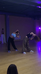 Two women perform choreographed routine in Balashikha dance studio