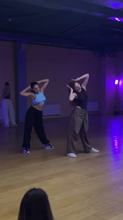 Two women perform choreographed routine in Balashikha dance studio