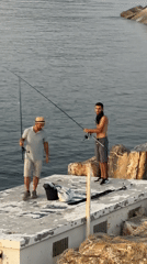 Fishing off a concrete jetty on the Ligurian coast