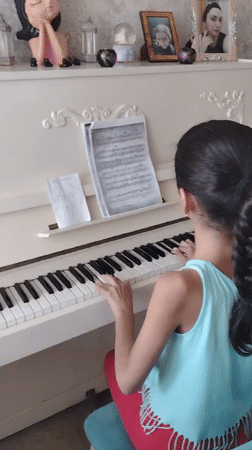 Kittens, flowers, and piano keys on a quiet Baku morning