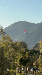 Paraglider spotted over coastal mountains in Fethiye, Turkey