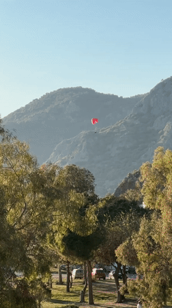 Paraglider spotted over coastal mountains in Fethiye, Turkey
