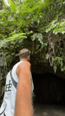 Tourists explore Indonesian waterfall destination in early morning hours