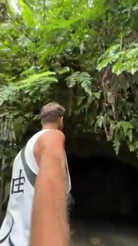 Tourists explore Indonesian waterfall destination in early morning hours