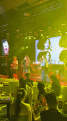 Live duo performance on dimly lit stage in Jiangbeicheng