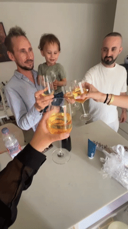Family celebration with toasts and balloons in Acre