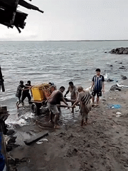Early morning waterfront activity captured in Lhokseumawe, Indonesia