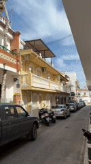 Man spots stuffed monkey decoration on Spanish building rooftop