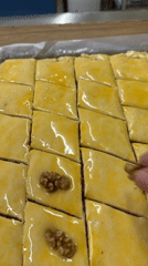 Baker prepares traditional baklava with walnuts in Patong
