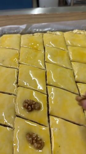 Baker prepares traditional baklava with walnuts in Patong