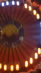 Spinning amusement ride operates with screaming passengers in Moscow