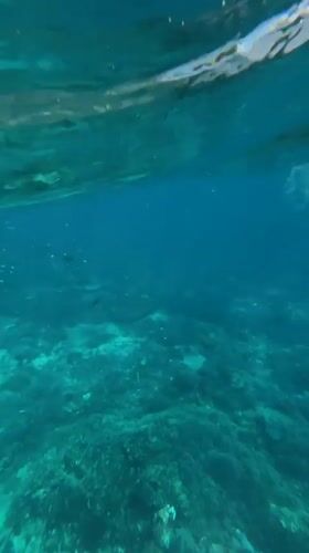 Diver enters turquoise waters off Nusa Penida coast